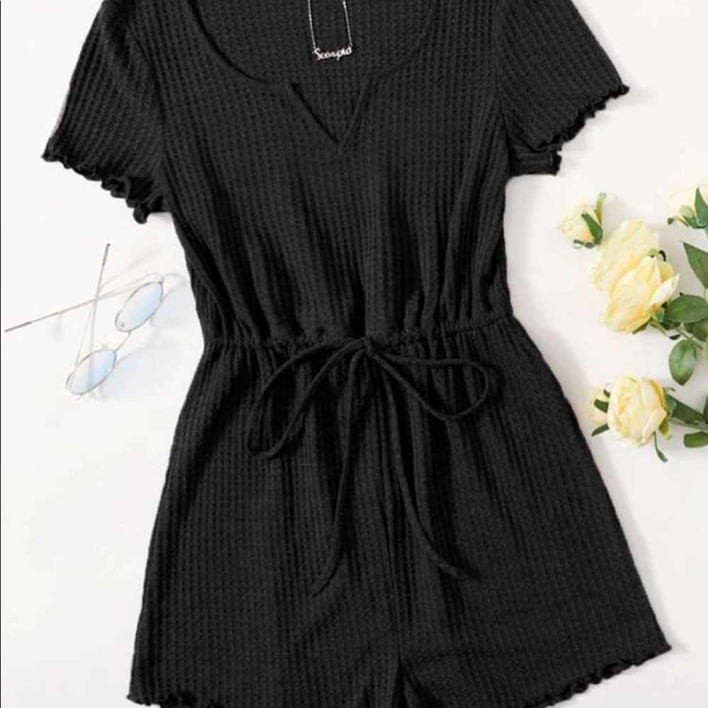 Black notched neck lettuce trim romper